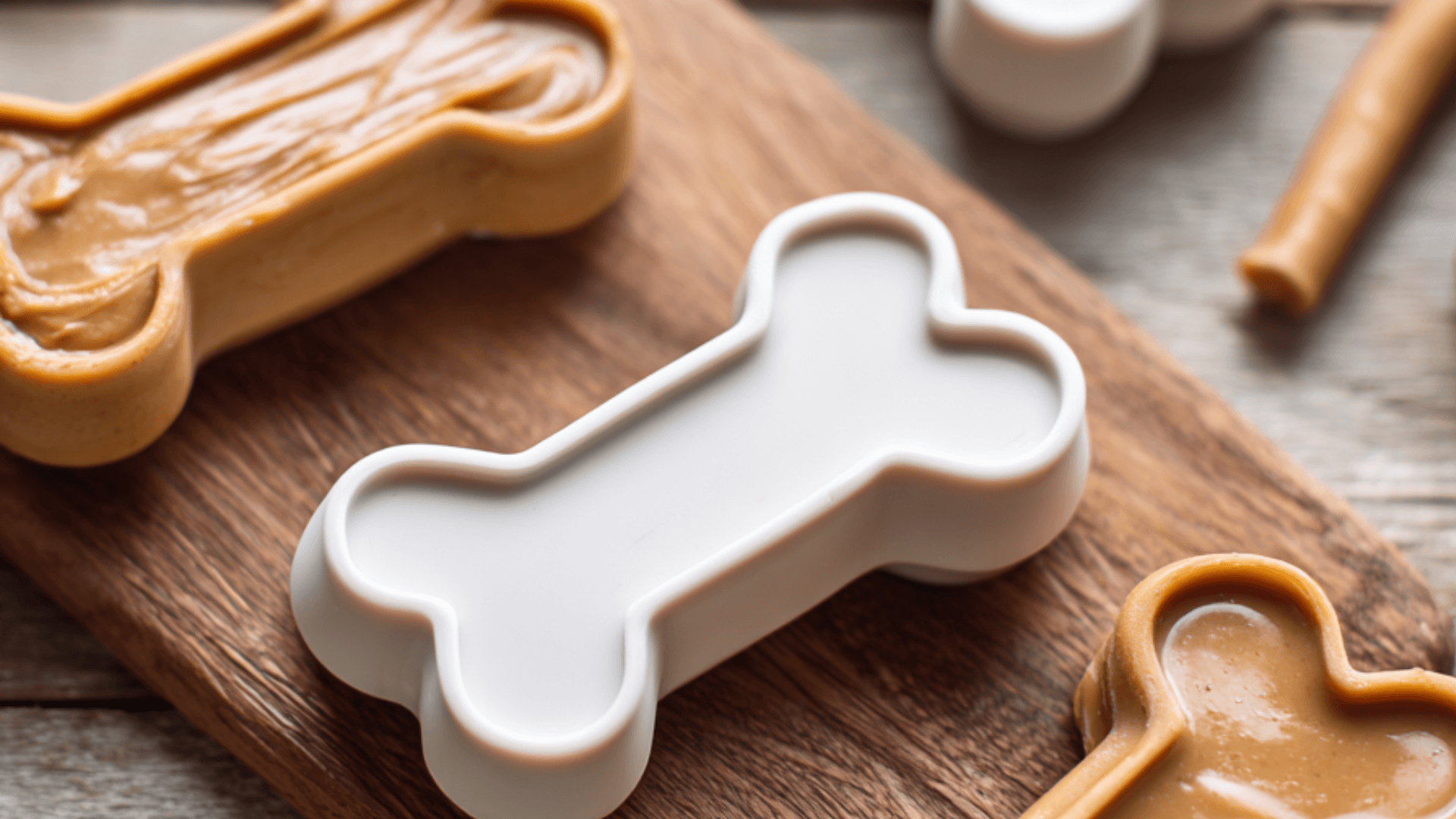 Healthy ingredients for Banana Yogurt Peanut Butter Frozen Dog Treats laid out on a kitchen counter